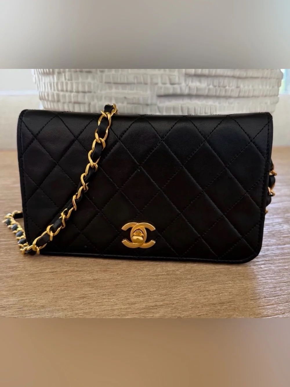CHANEL Black Quilted Shoulder Bag with Gold Chain and CC Lock